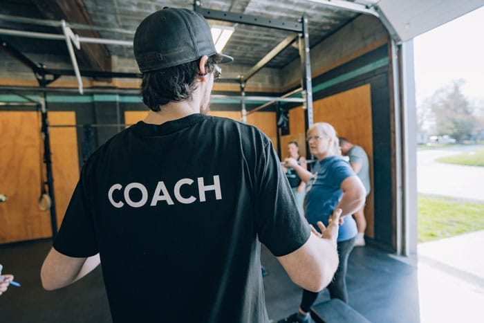 Coach instructing a group during a training session