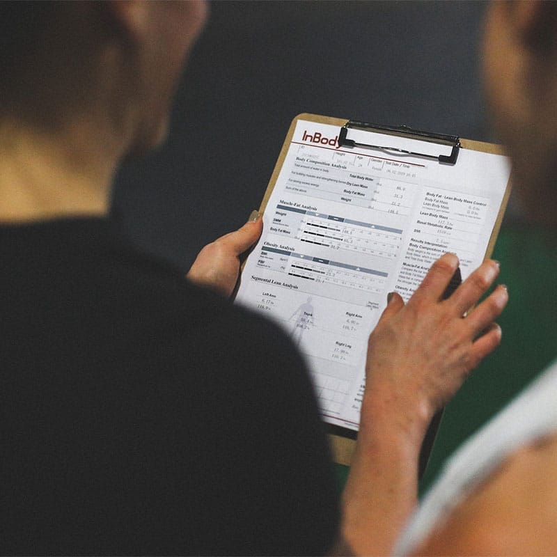 Coach holding nutrition results